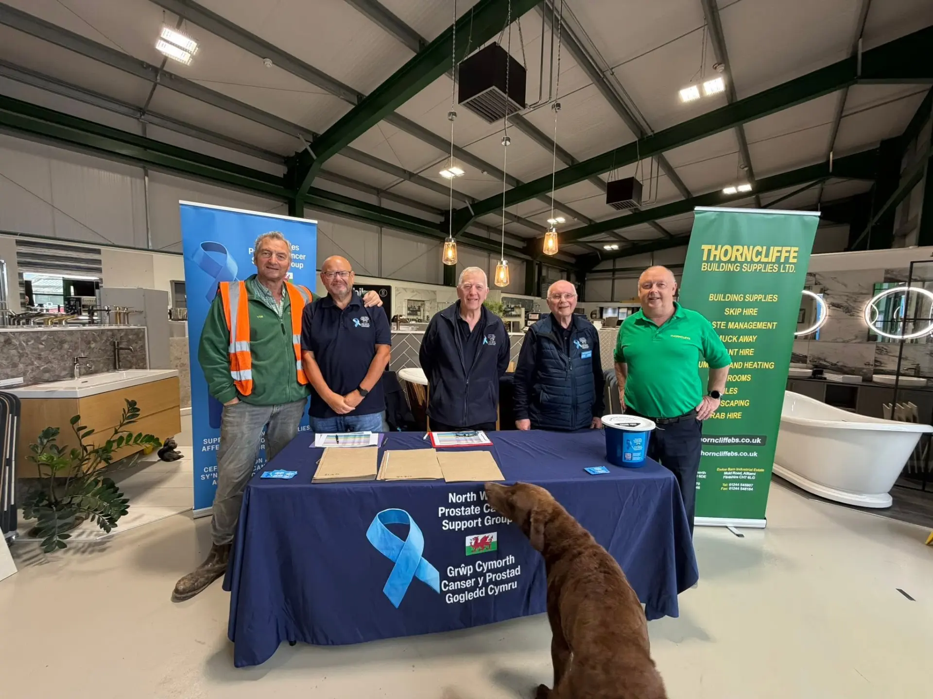 Volunteers and supporters behind the group's fundraising stand at Thorncliffe Building Supplies